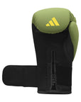 Green and black boxing glove by Adidas x Anderson Silva.