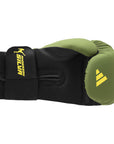 Black and green boxing glove by Adidas x Anderson Silva.