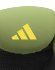 Green Adidas boxing glove with yellow logo.