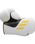 White boxing gloves with yellow stripes, Adidas x Anderson Silva collection.