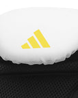 White boxing glove with yellow logo from Adidas x Anderson Silva collection.