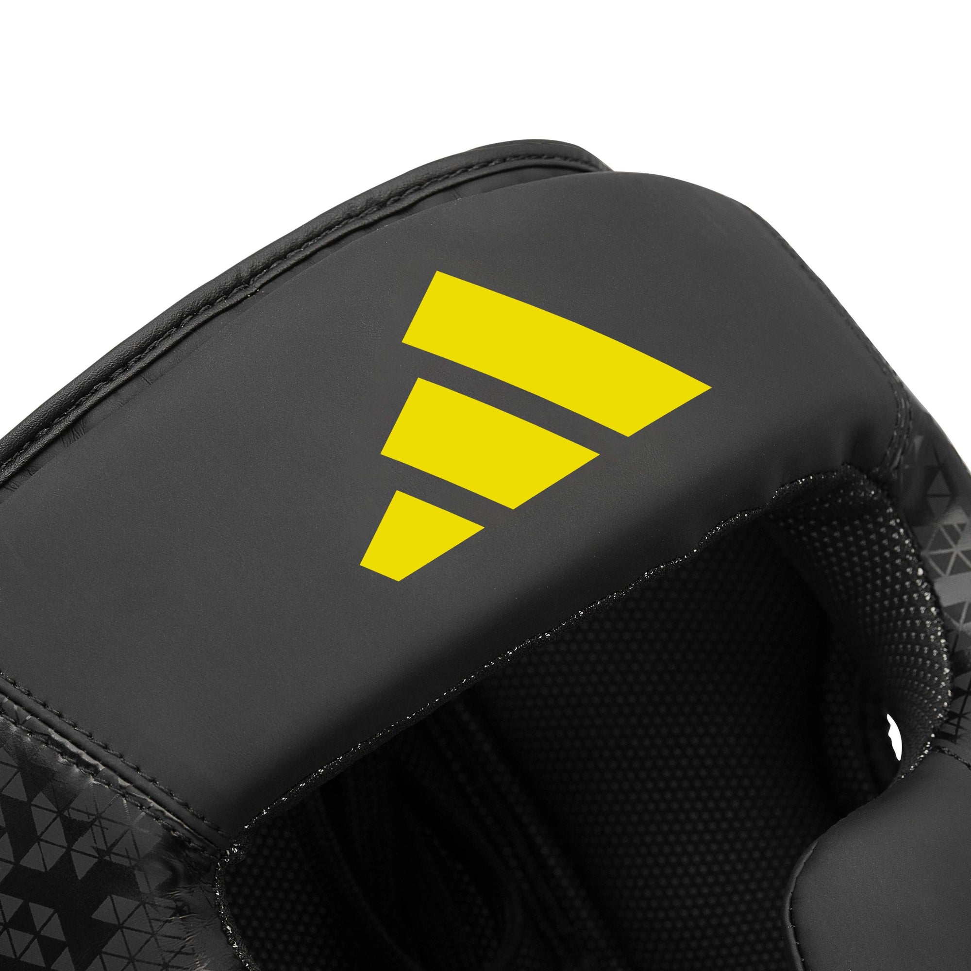 Close-up of a black and yellow boxing head guard.