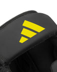 Close-up of a black and yellow boxing head guard.