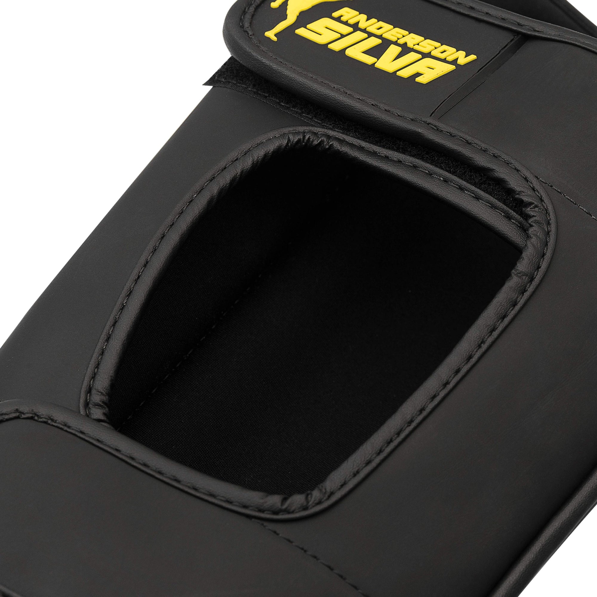 Black bag with yellow logo designed for boxing.