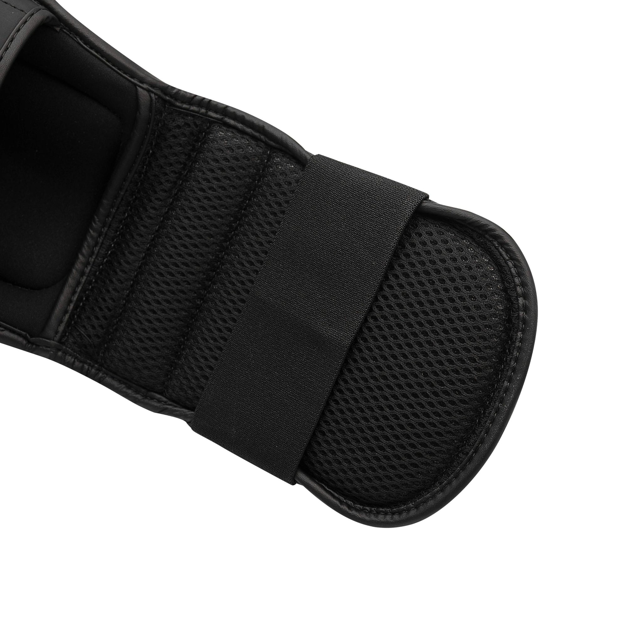 Black glove with black strap close-up image for boxing gear.