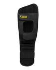 Black leg guard with yellow Adidas text.