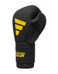 Black boxing glove with yellow logo, Adidas x Anderson Silva.