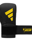 Black boxing glove with yellow Adidas logo.