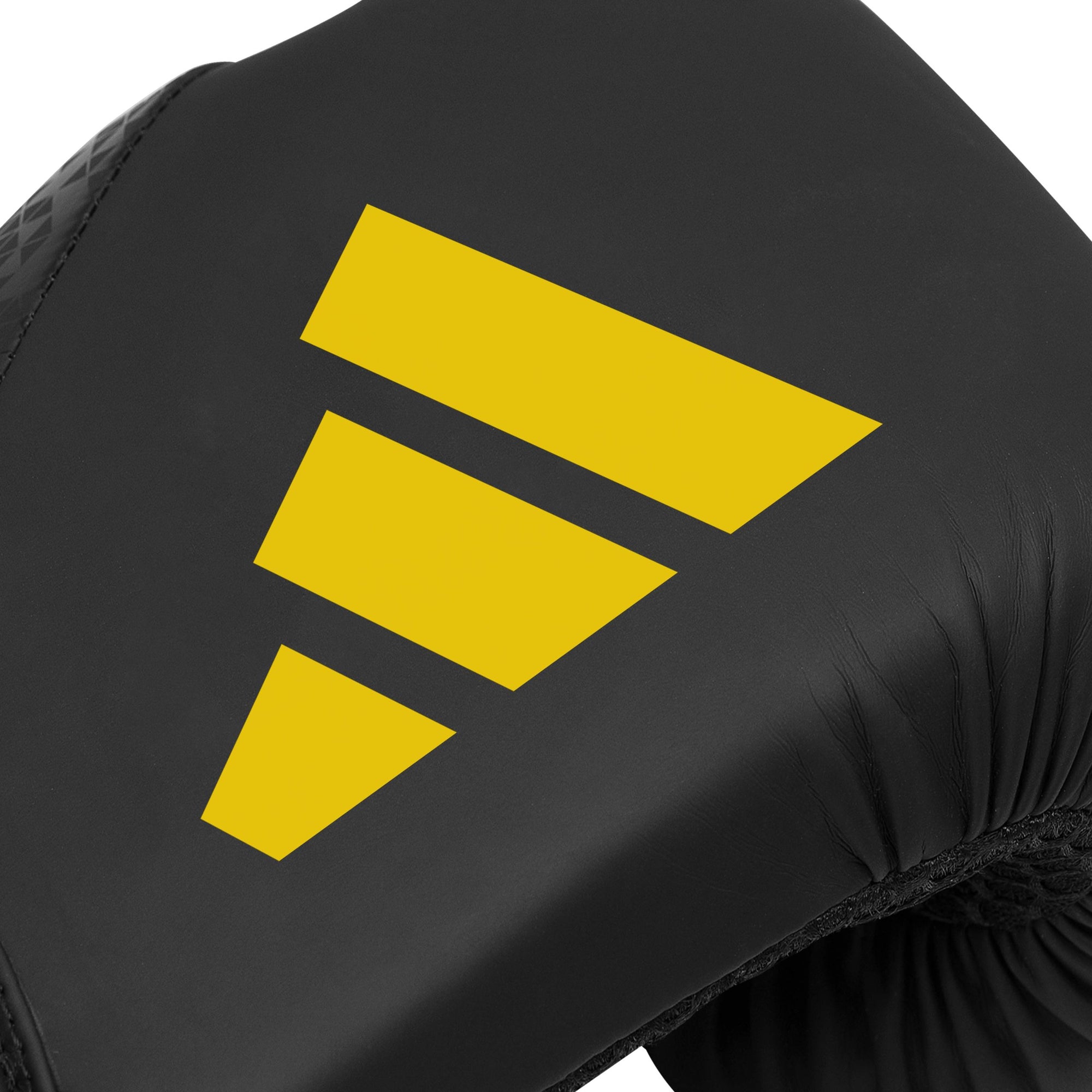 Close-up of black glove with yellow Adidas logo.