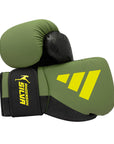 Pair of green and black MMA boxing gloves with yellow accents.