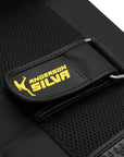 Black and yellow strap with yellow text on Adidas x Anderson Silva thigh pad.