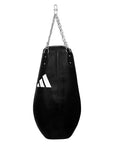 Black punching bag with chain for boxing training.