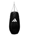 Black punching bag with chain for boxing training.