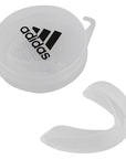 Clear plastic container with Adidas logo for junior mouth guard.