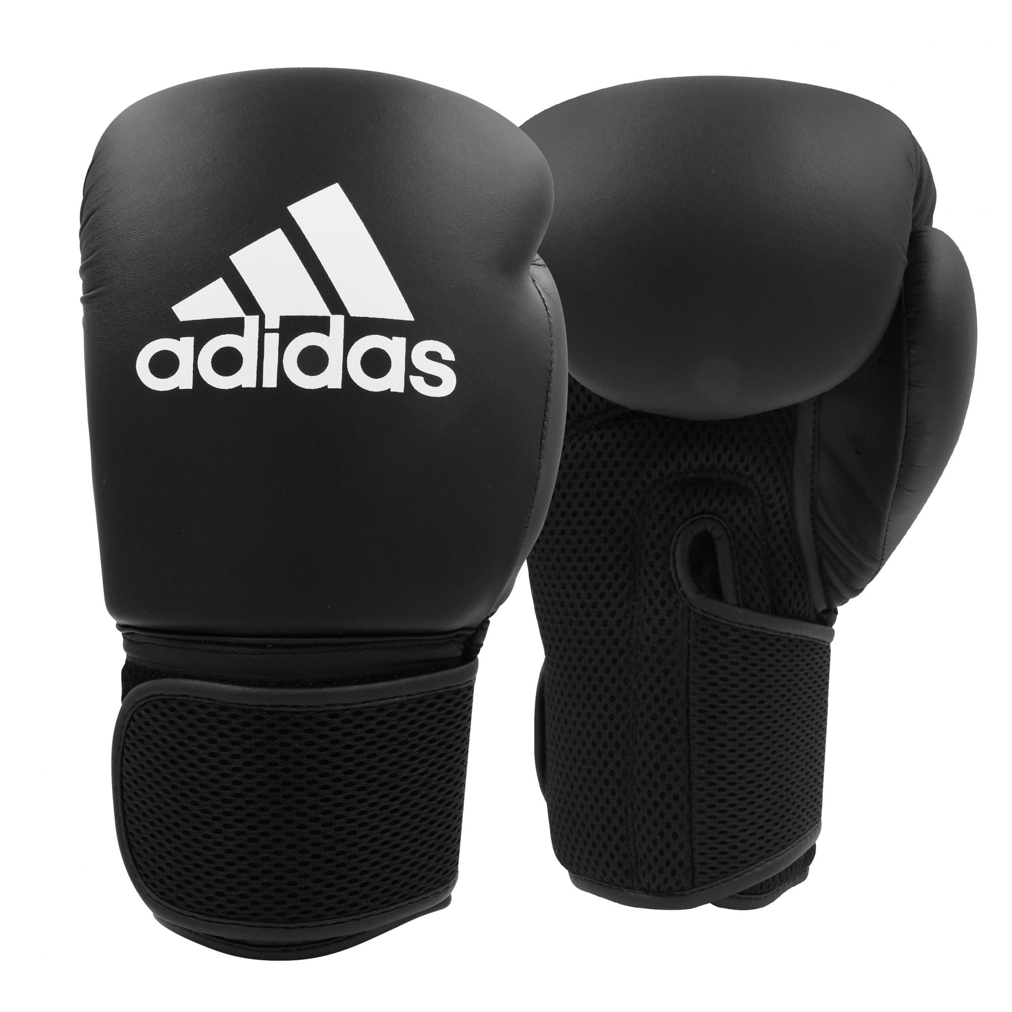 A pair of black boxing gloves in adidas boxing home training kit for adults.