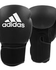 A pair of black boxing gloves in adidas boxing home training kit for adults.