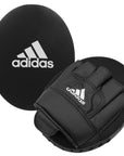 A black glove with a white logo from adidas home training kit.