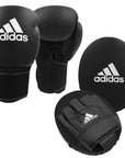 Pair of adult black boxing gloves, part of adidas training kit.