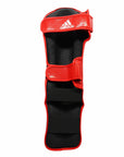 A red and black leg guard, part of the adidas Super Pro Shin N Step Protector.