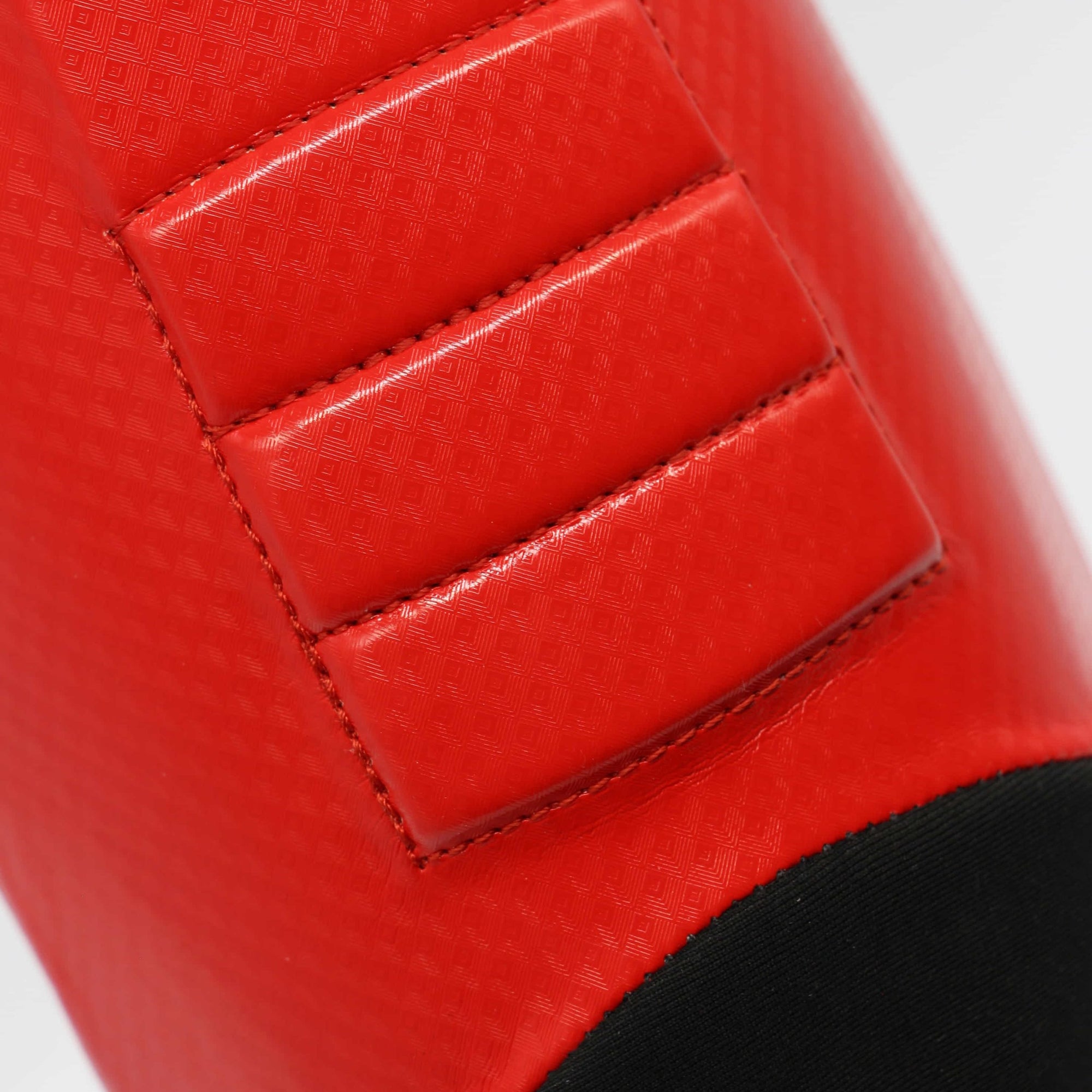 Close-up of red and black leather object.