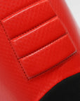 Close-up of red and black leather object.