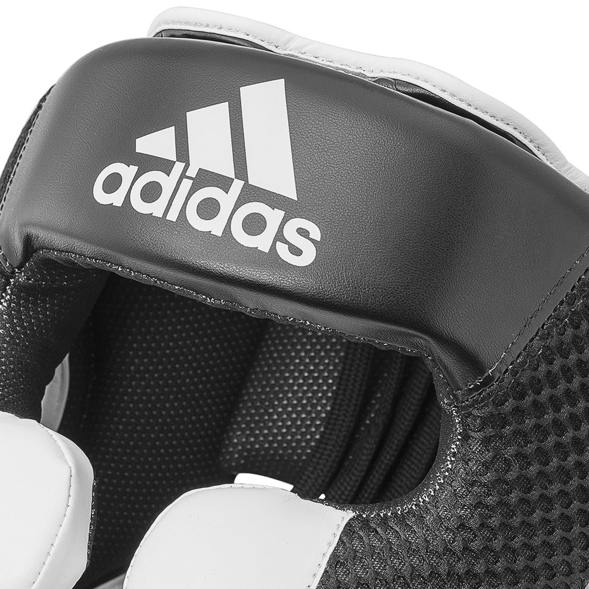 Close-up of a black and white boxing glove.