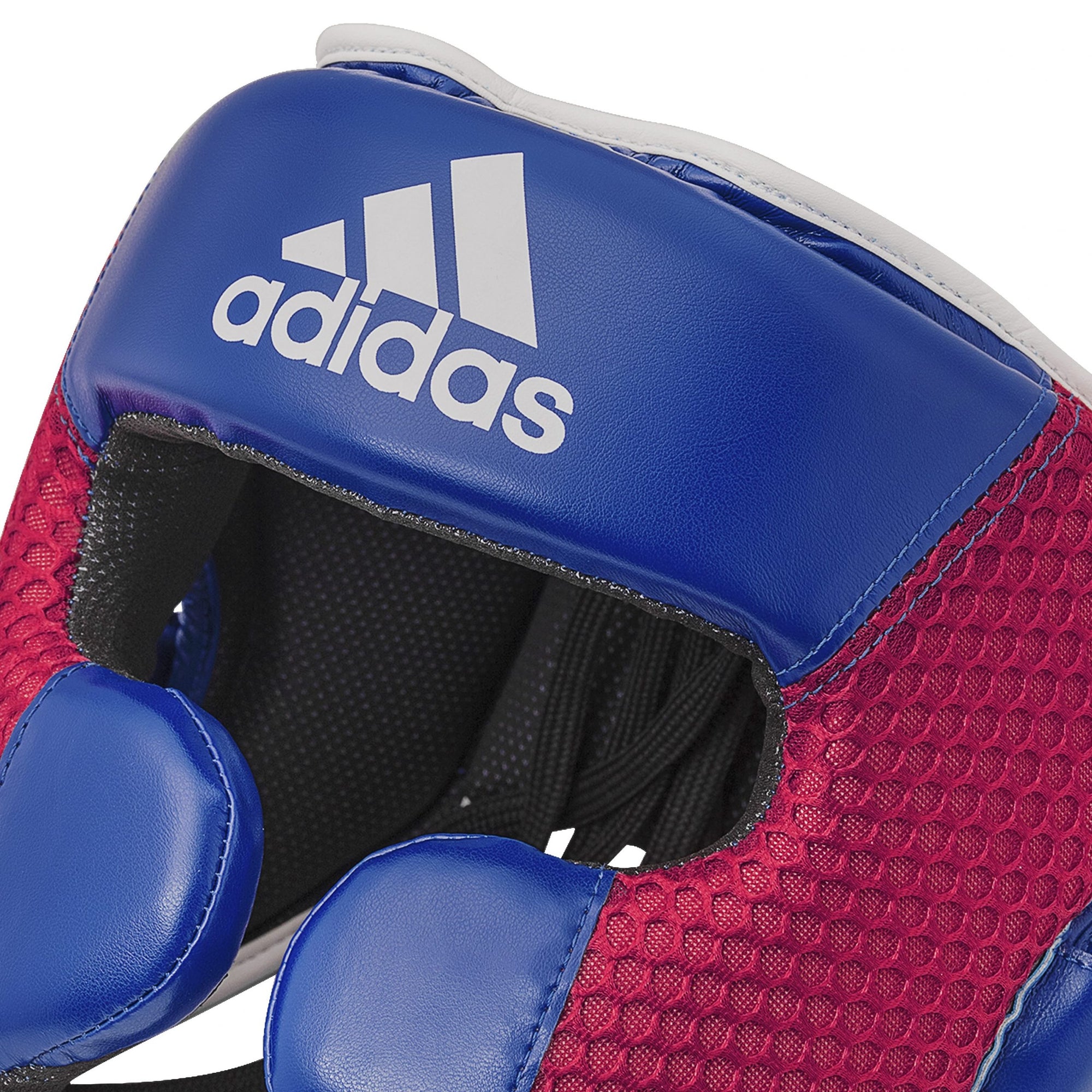 Close-up of Adidas Hybrid 150 boxing helmet, red/white, size M.