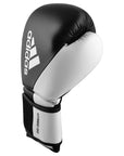 Single adidas Hybrid 150 boxing glove in black and white, 14 oz weight.