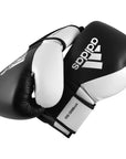 Pair of black and white adidas Hybrid 150 training gloves, 14 oz.