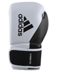 Adidas boxing glove with brand logo in black and white.