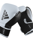 Pair of adidas Hybrid 150 boxing gloves in black and white.