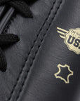 Close-up of black and gold adidas boxing glove.