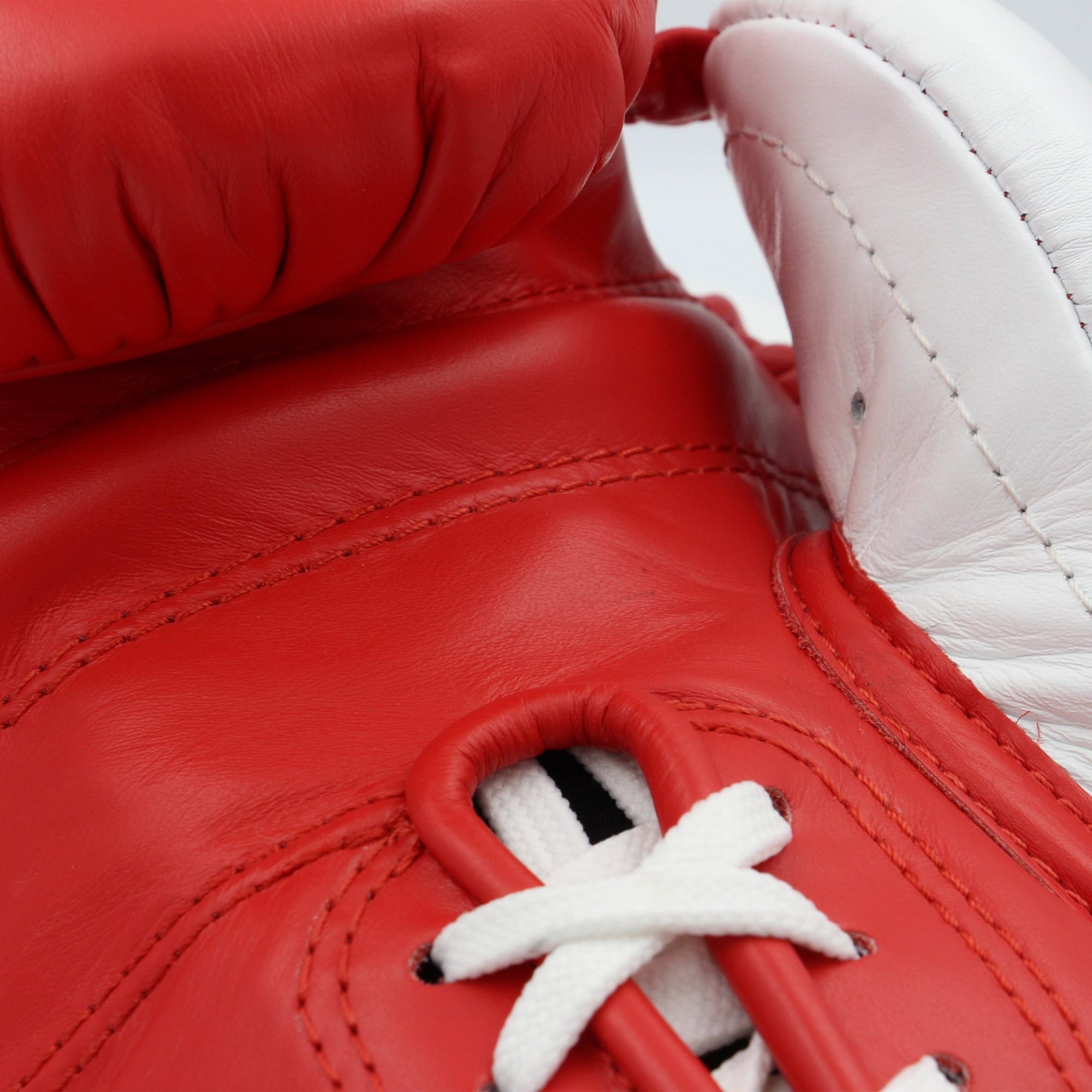 Close-up of red and white boxing glove from adidas Adi-Power Hybrid 500.