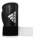 Black boxing glove with white stripes, adidas Hybrid 65, 12 oz.