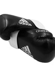 Pair of adidas Hybrid 65 boxing gloves, 14 oz, black and white.