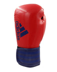 Red boxing glove with blue stripes Adidas hybrid.