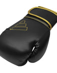 Black boxing glove with gold trim, Adidas Hybrid 80, 10 oz.