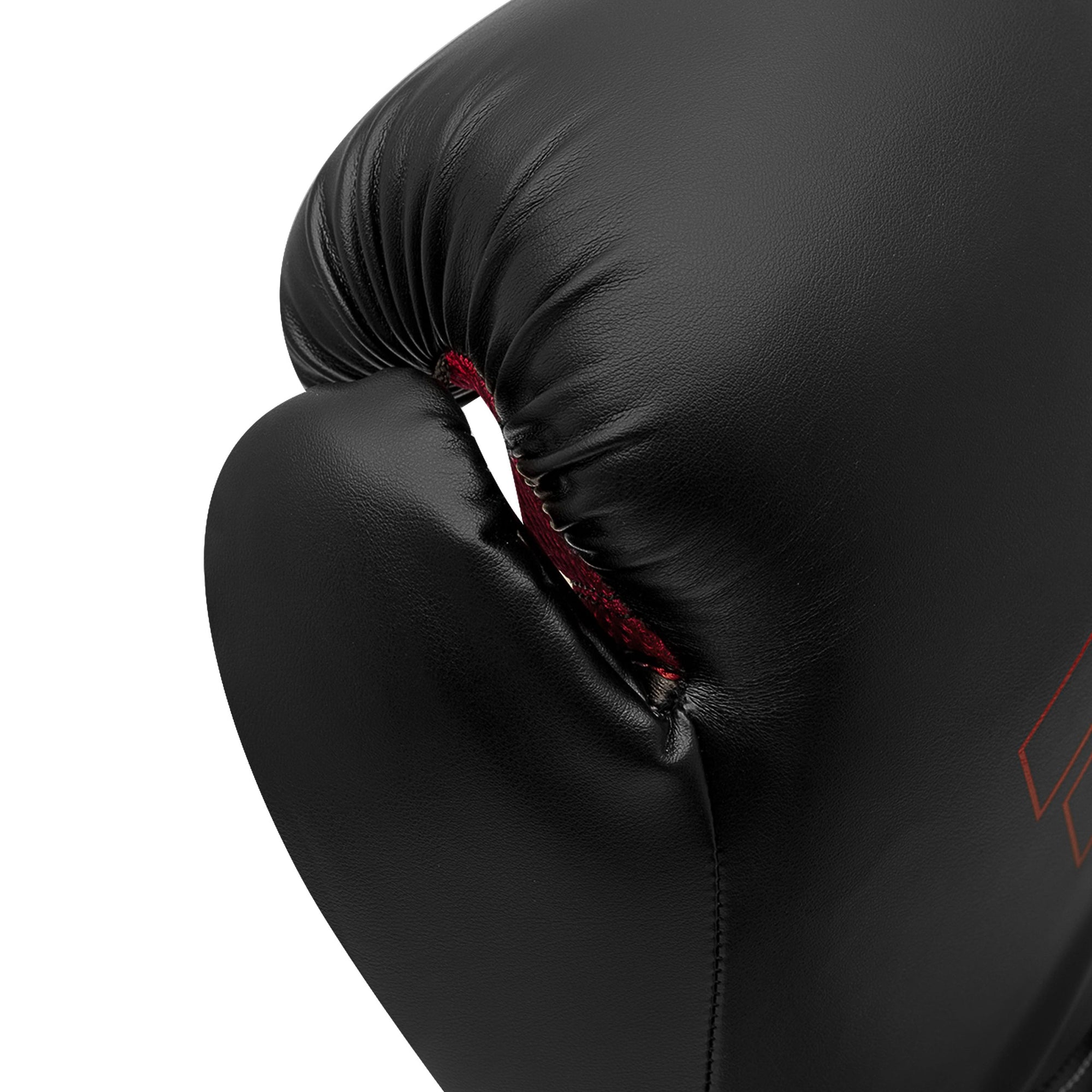 Close-up of Adidas Hybrid 80 boxing glove in black and red.