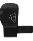 Black boxing glove with white trim, Adidas Hybrid 80 Training Gloves.