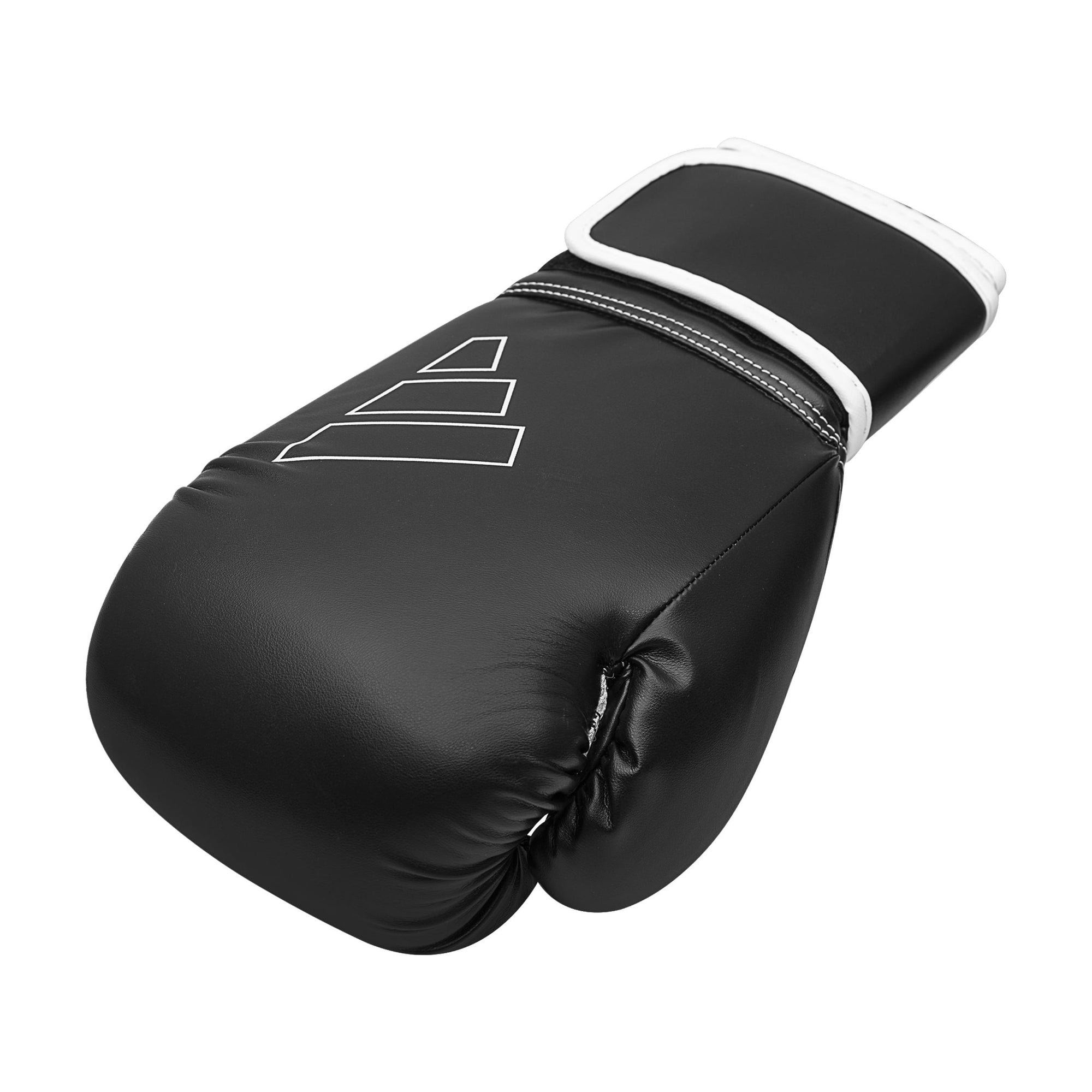 Black boxing glove with white trim by Adidas.