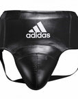 Black leather boxing groin protector with white accents.