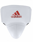 White boxing pad with red adidas logo.