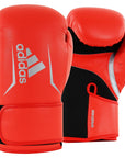 Pair of red boxing gloves with black accents, 14 oz.