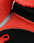 Close-up of a boxing glove, Adidas Speed 100 in solar red, 16 oz weight.