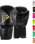 Pair of black and gold boxing gloves for boxing and kickboxing.