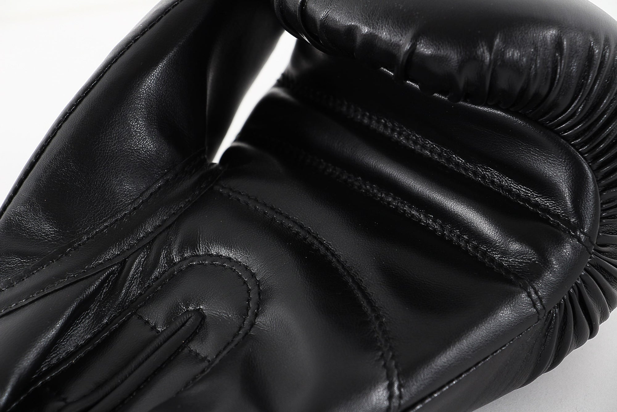 Close-up of a black adidas boxing glove.