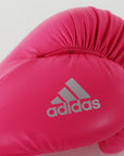 Pink boxing glove showcasing adidas logo.