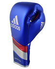 A blue boxing glove with red and white stripes from adidas Adi-Speed 500.