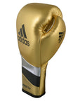 Gold boxing glove with black and silver stripes, Adidas Adi-Speed 500.