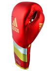 Red boxing glove with gold stripes, adidas Adi-Speed 500 Pro.